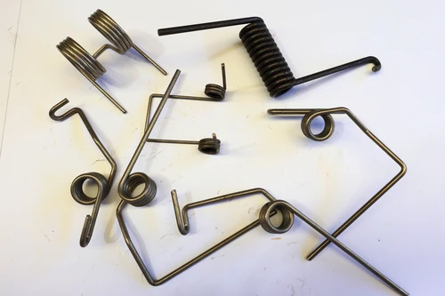 Different samples of torsions springs custom made by Boynes Springs in Perth, WA.