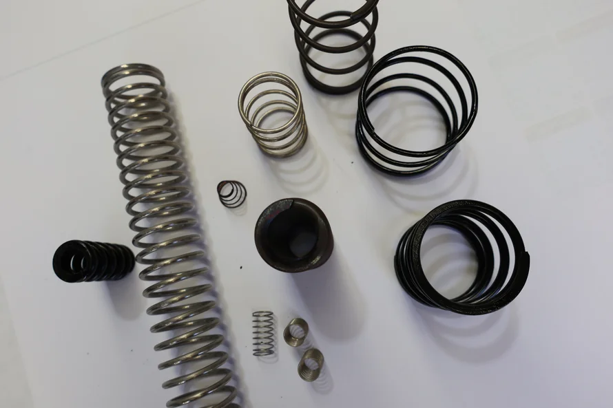 Various sizes of springs for mining machinery, custom-manufactured in Australia by Boynes Springs, Perth-based local spring supplier.